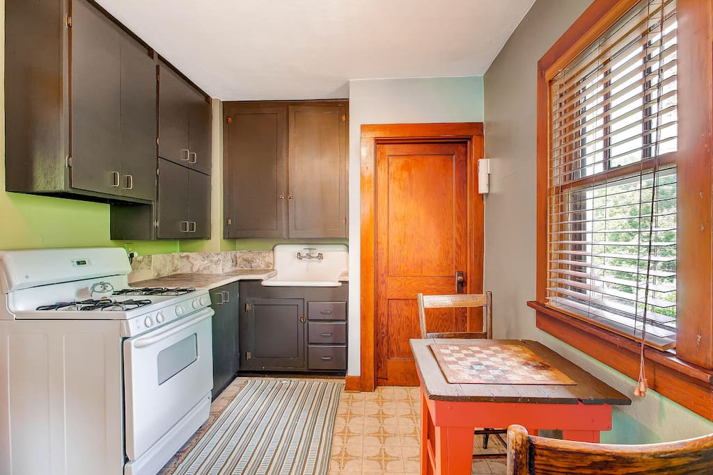 Kitchen has full size fridge and portable dishwasher.