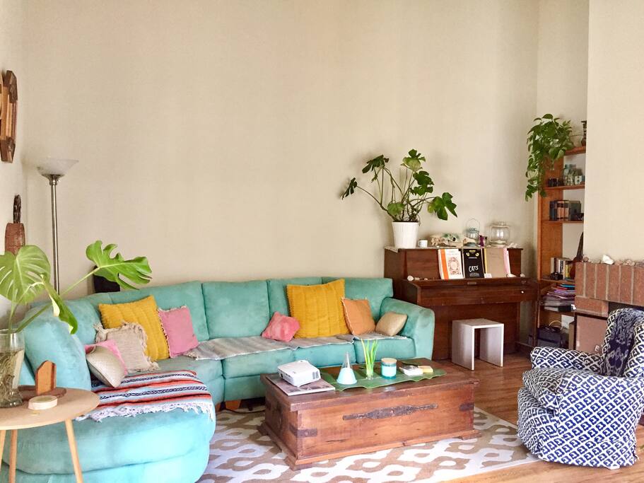 Living room (still being decorated). Piano, guitar, ukulele, games, projector tv, and more!