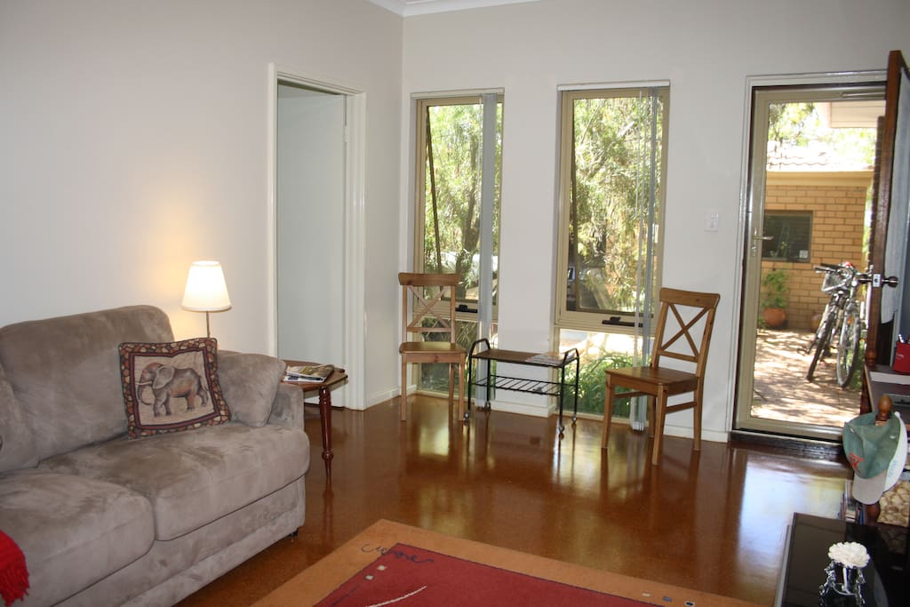 North facing front door and windows off courtyard with bikes. Lounge with steel security screens and door, cork floor, extra comfortable sofa converts to double bed.