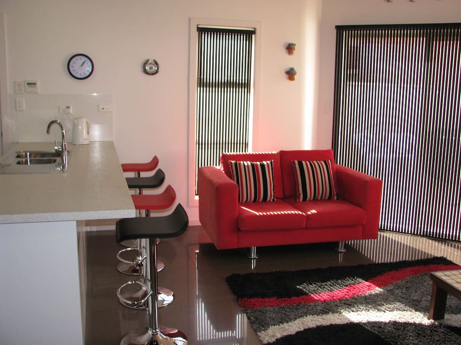 Large and light kitchen, dining, living space, opens out to barbecue area.