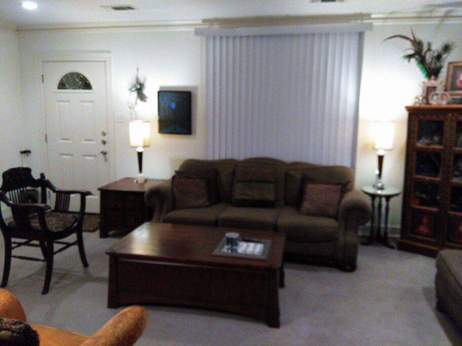 Living area showing front door into living room from porch.