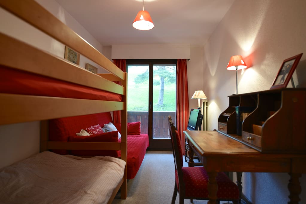 Second bedroom with balcony and desk