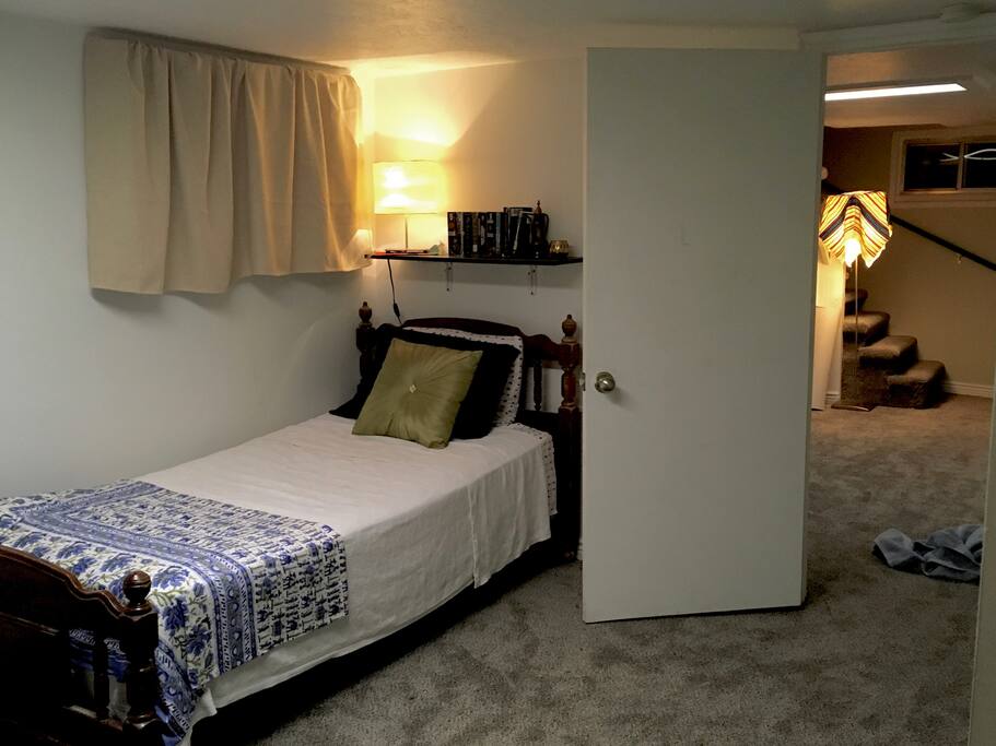 The first bed with its own reading light above it.