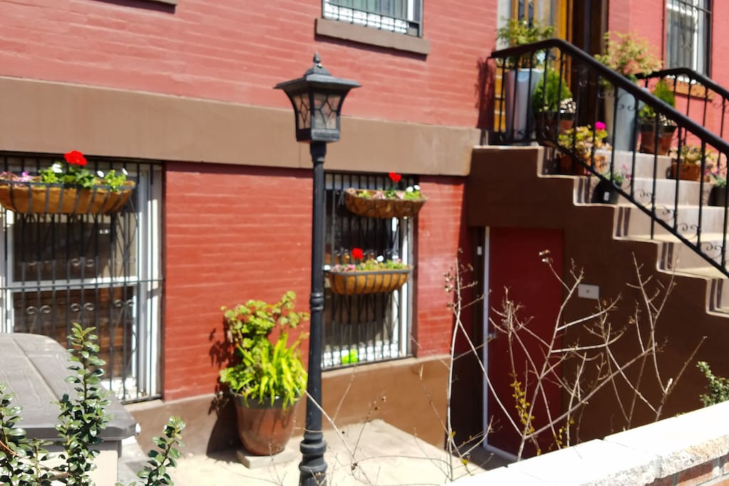 Sunny front patio in Brooklyn brownstone.