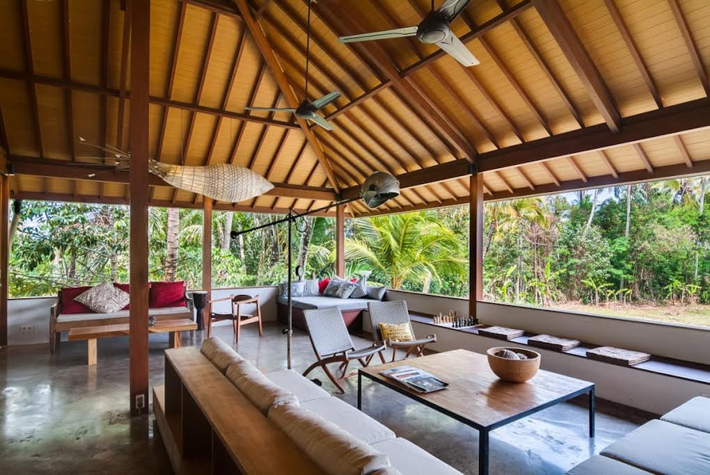 Large open living, dining room with jungle and ricefield views. Enough space for yoga, kids to run around. Or relax at home the whole day.