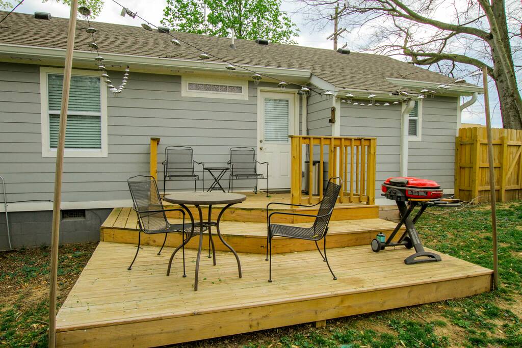 A gas grill and 2-person bistro table on the charming deck