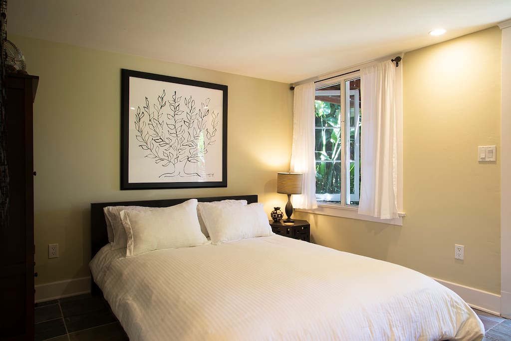 Zen bedroom looks opens to beautiful gardens and canyon.