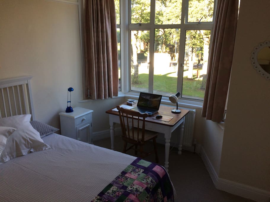 Business visit friendly. Large desk, full fast broadband access, bright with window view onto the green, desk lamp and power source