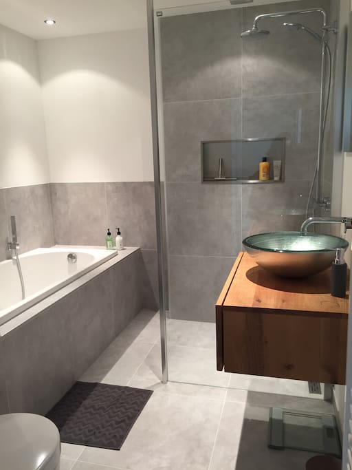 Renovated bathroom with separate bath