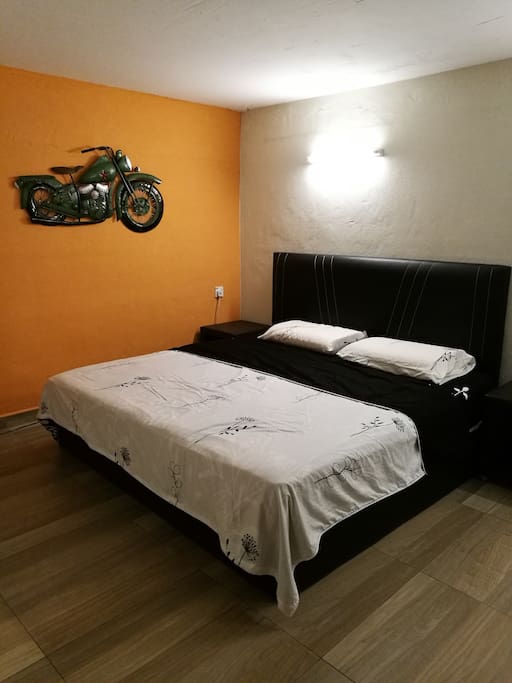 Private bedroom with king size bed.