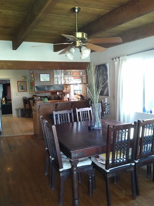 Dining Room. Open door in the back is a studio / 2nd Living Room with Large Screen TV