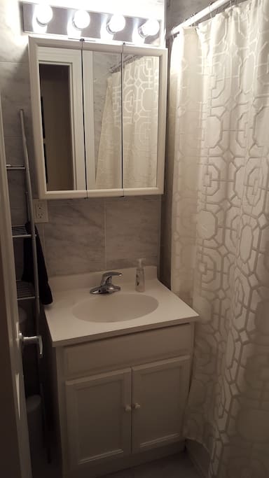 Bathroom that has a tub for soaking your feet after walking the streets of NYC all day.