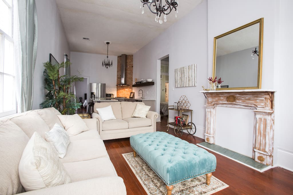 Enter through the bright living room, which offers plenty of comfortable seating and a queen size pull out sofa.