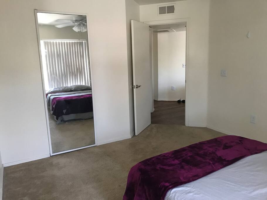 Bedroom with full length mirror