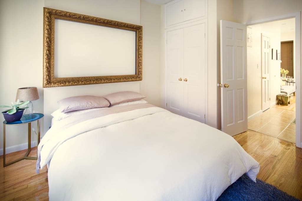 Brand new queen sized bed, soft sheets, and a feather duvet for your happy slumber. Large closet with hangers/iron/ironing board provided. Very warm radiators with adjustable heat