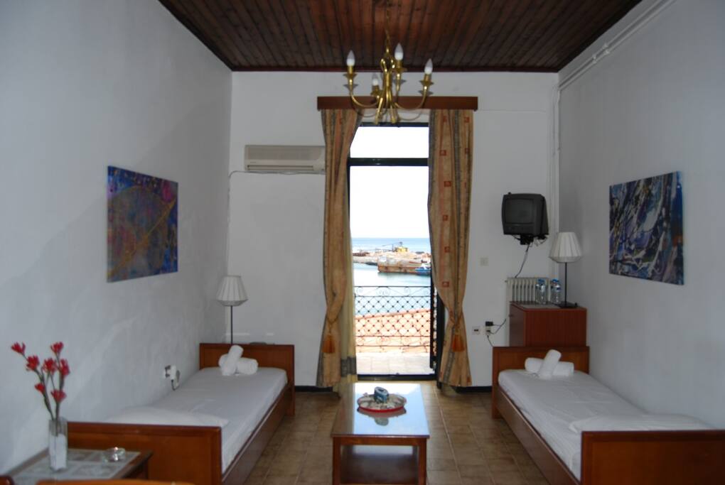 living room with two sofas that can turn itno comfortable single beds