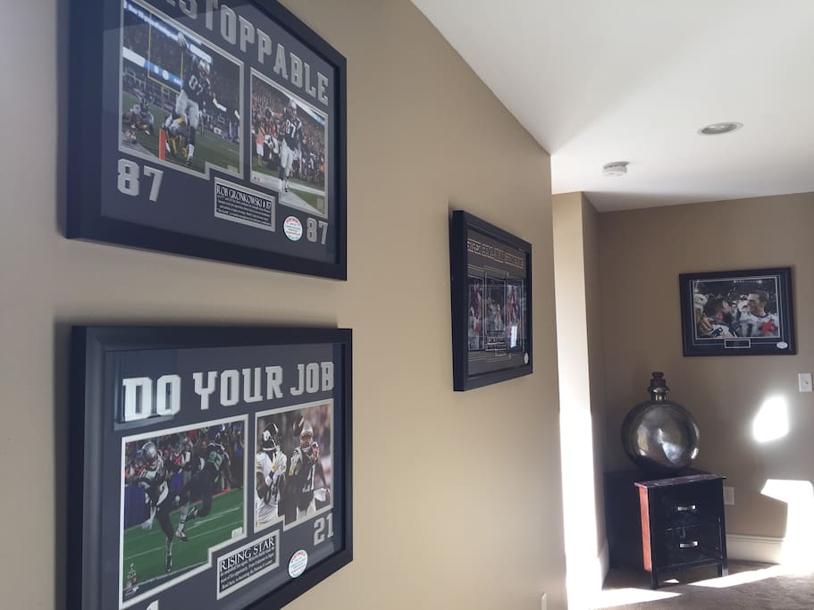 walls filled with Sports World Patriots and Boston Memorabilia