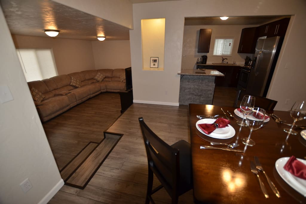 View of open area in dining room looking into the living room and kitchen.