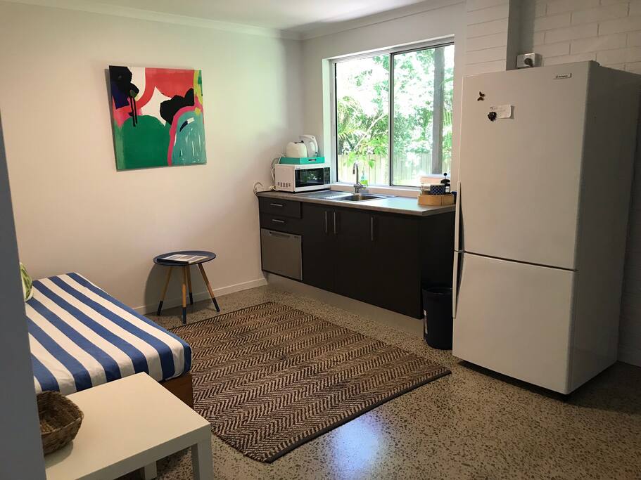 The kitchenette with large fridge, microwave, dishwasher, toaster, kettle and some basics for cooking if you wish to -oil, salt and pepper, tea and plunger coffee.