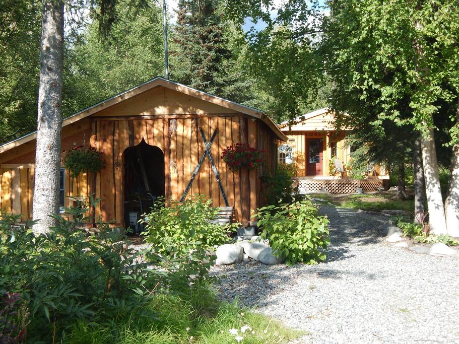 The pathway to the guest cabin (background) leads past the woodshed which houses our winter firewood supply - the primary heat source at Basecamp.