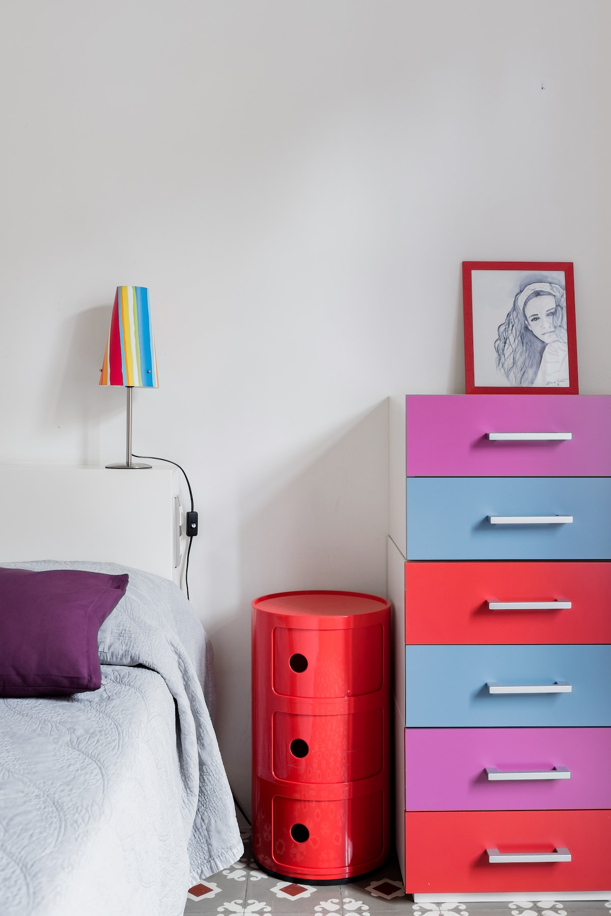 Multi-color furnishings with a watercolor and sunrise portrait.