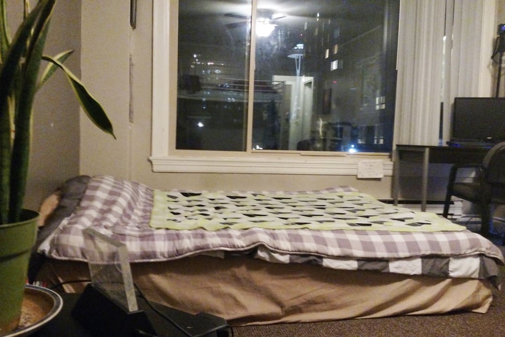 Queen-sized bed & space needle