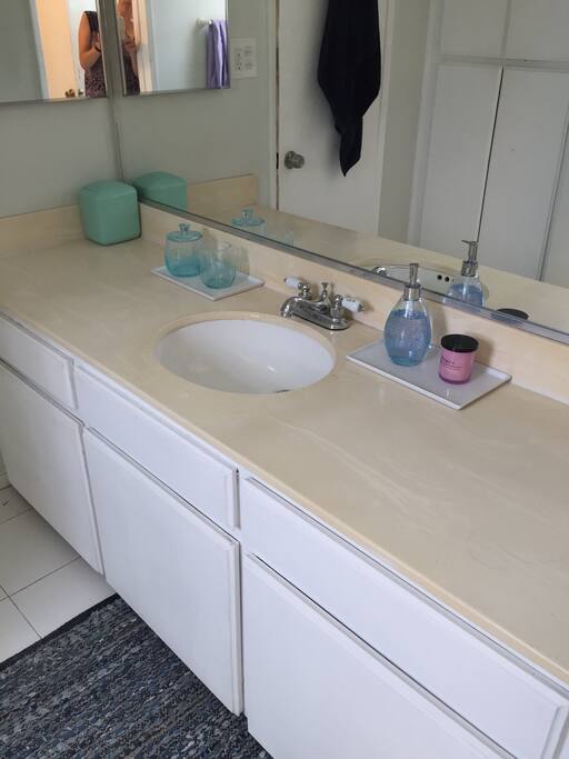Plenty of counter space in addition to plenty of cabinet space and a medicine cabinet.