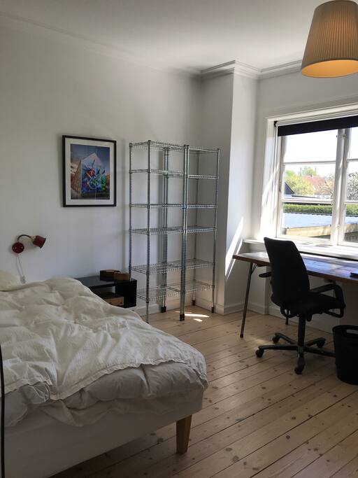 Spacious bedroom with working table.