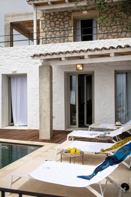 Outdoor area with the pool & the entrance