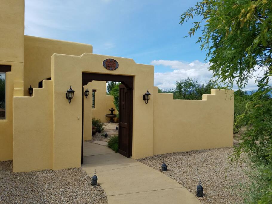Mission style doors that lead to courtyard