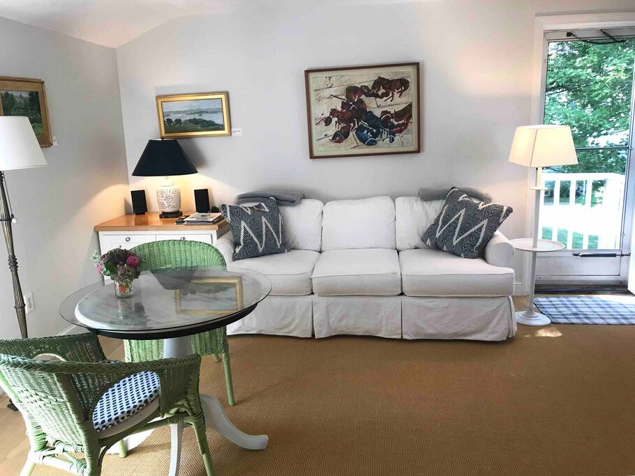 Private entrance, comfy sofa and chairs.