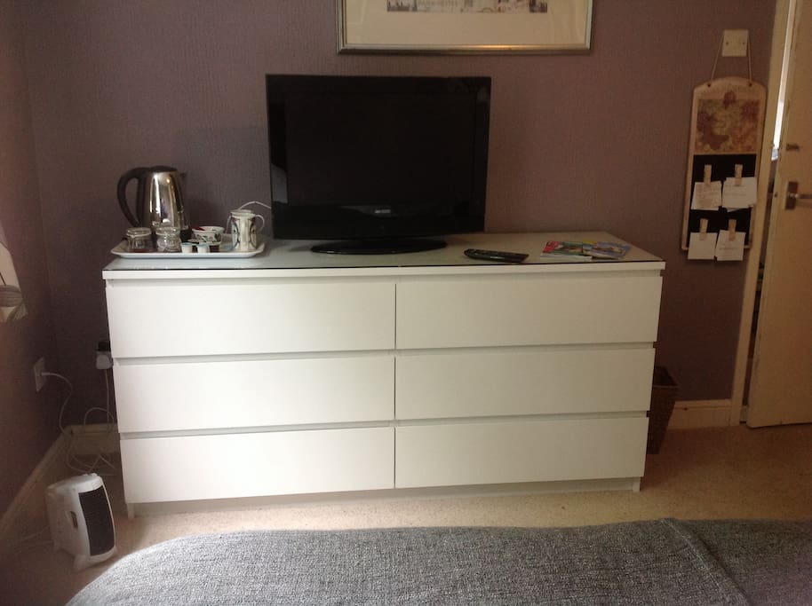 TV, hot drinks and clothes storage.