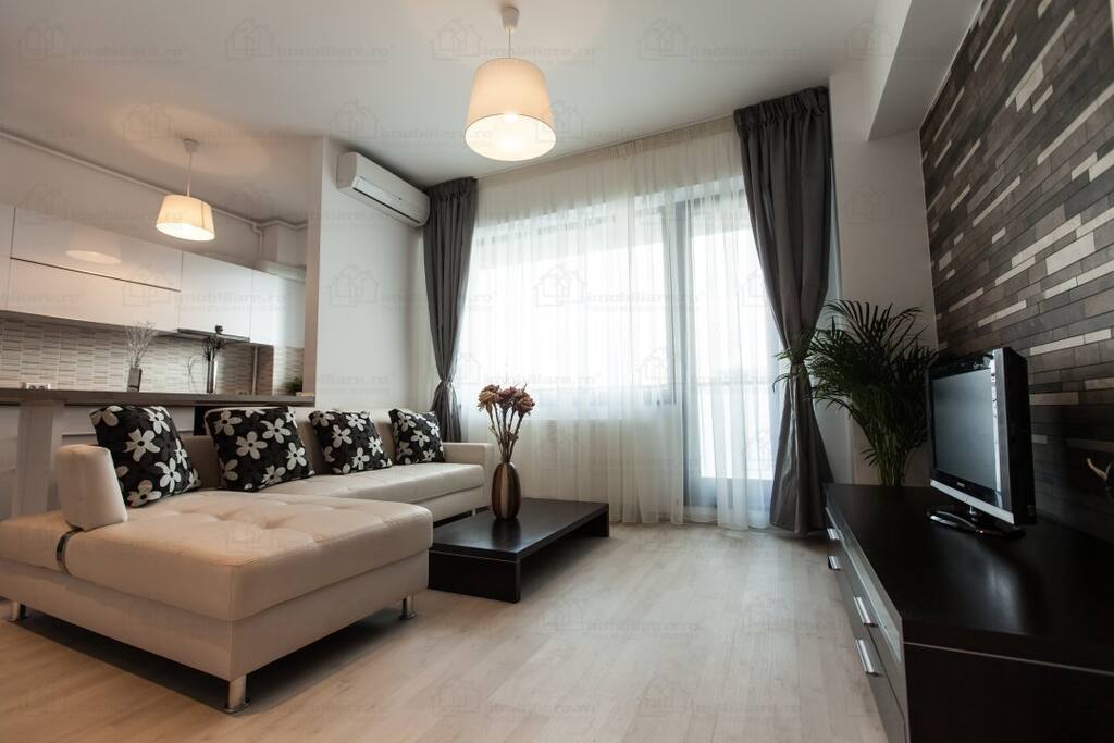 Living room, open kitchen and the balcony