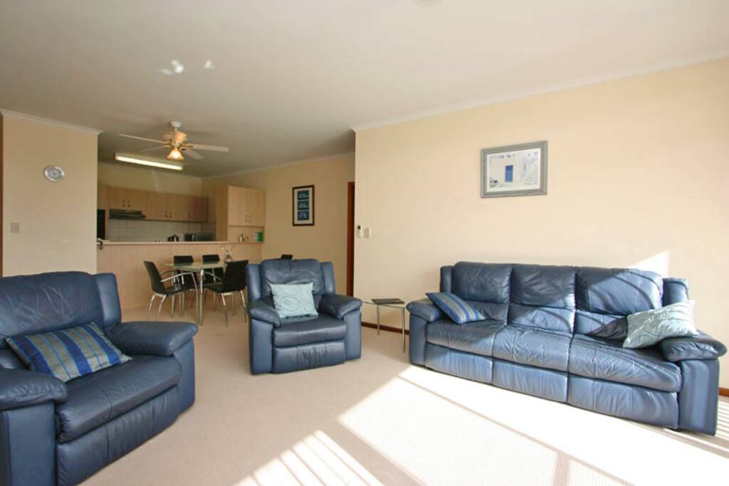 Leather lounge suite with recliners