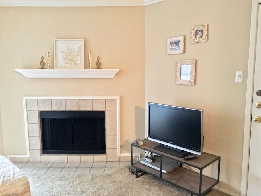 TV and fireplace in living room