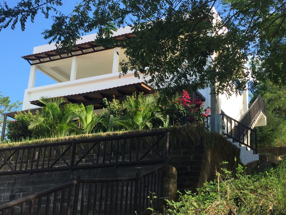 Newer home with upper terrace is an easy walk to beach and town