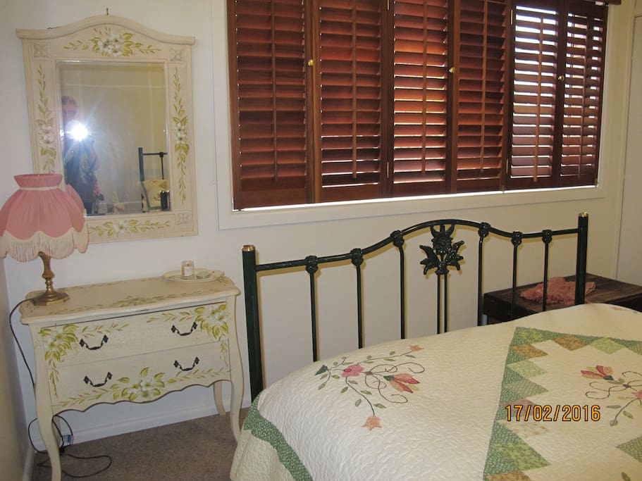 Double bedroom has cedar blinds