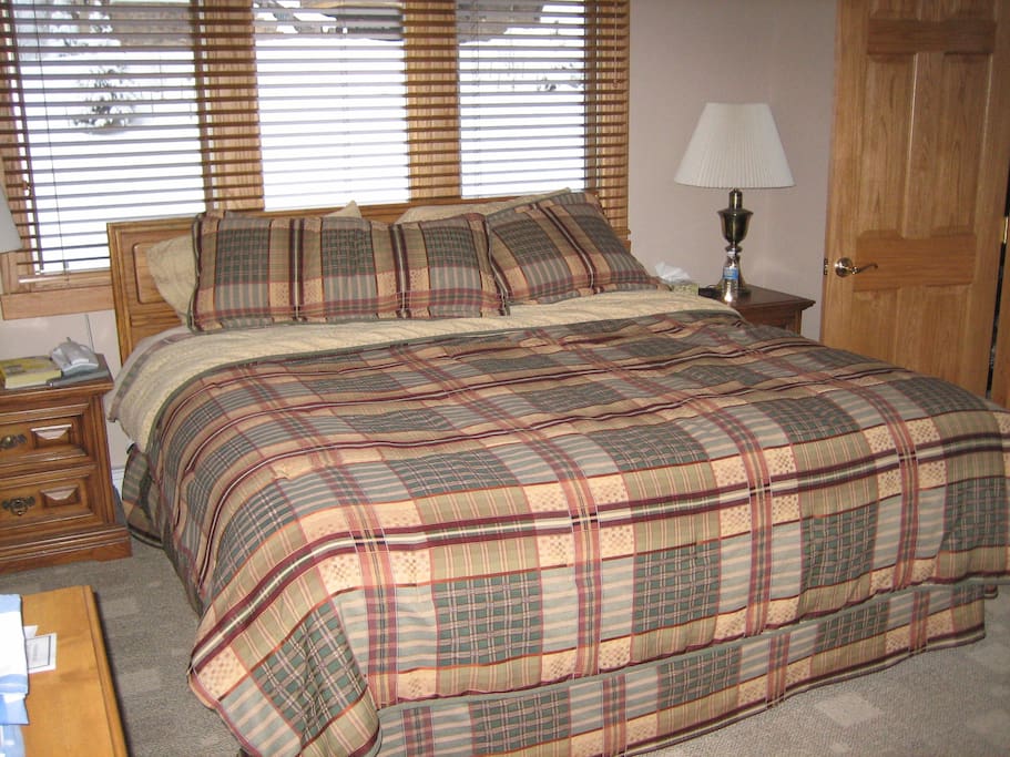 Main bedroom on the third floor. There is a view from this bedroom of the ski mountain from windows at the top of the wall.