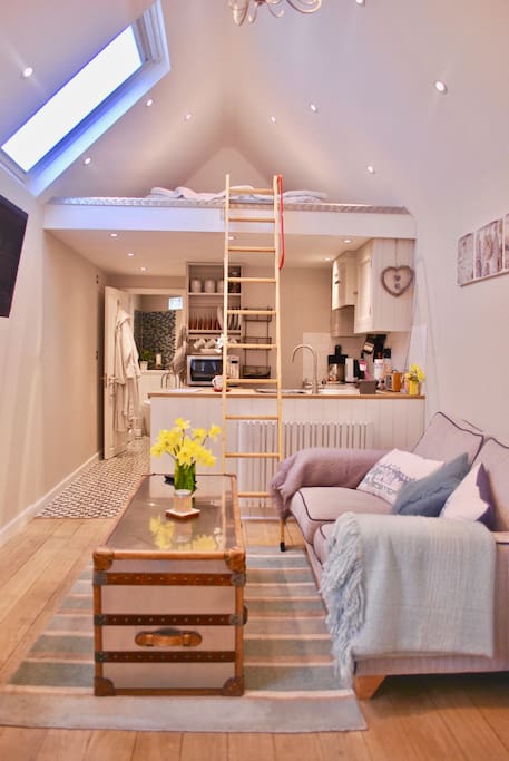 Ladder to mezzanine floor (at visitors risk, not suitable for elderly/infirm) with sunken Vi-spring bed, bedside lights and phone chargers
