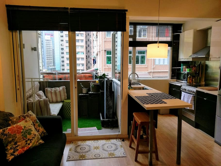 With a balcony and a open concept kitchen.