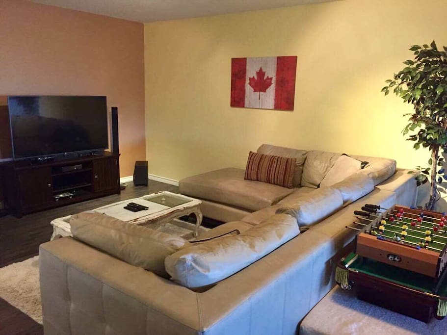 Oversized leather sectional, 55 inch 4K tv, Xbox 360, Netflix, DVD collection for you to relax and enjoy