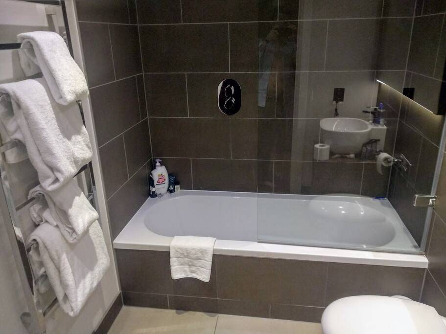 Fresh towels and a relaxing bathtub