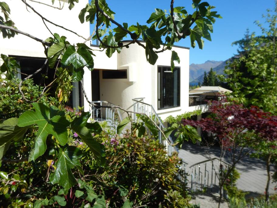 House in Late Spring with beautiful flowers and shrubs