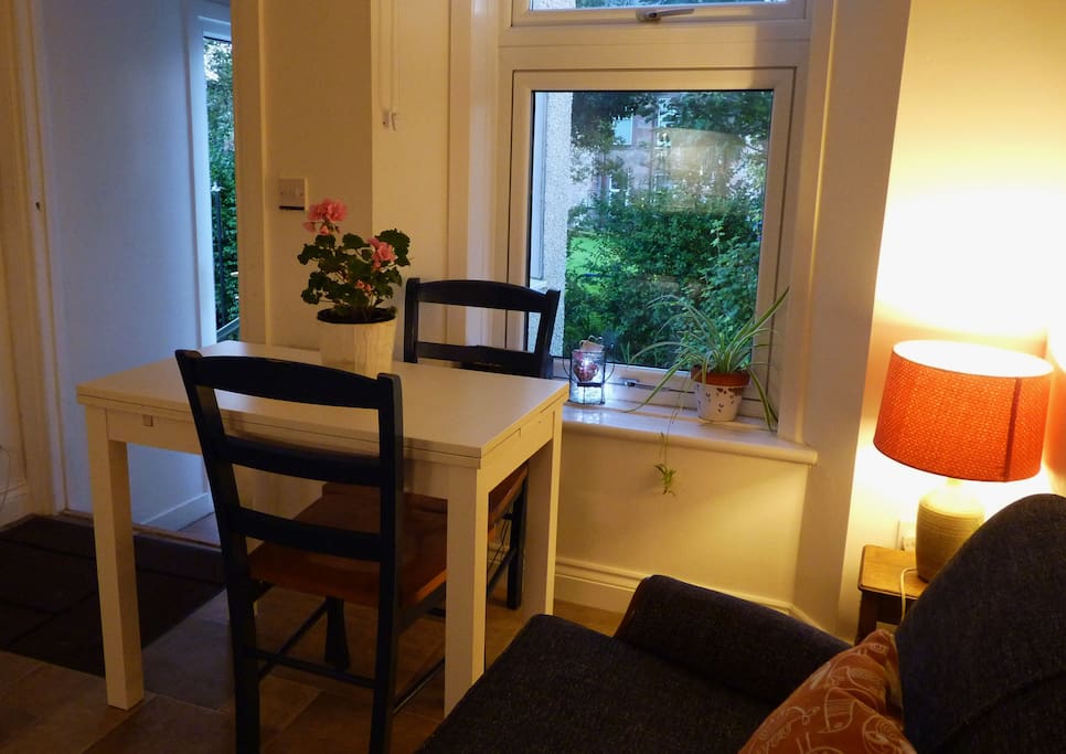 the kitchen has a little seating area, so that you can gaze out onto the garden.There's a TV in here too.