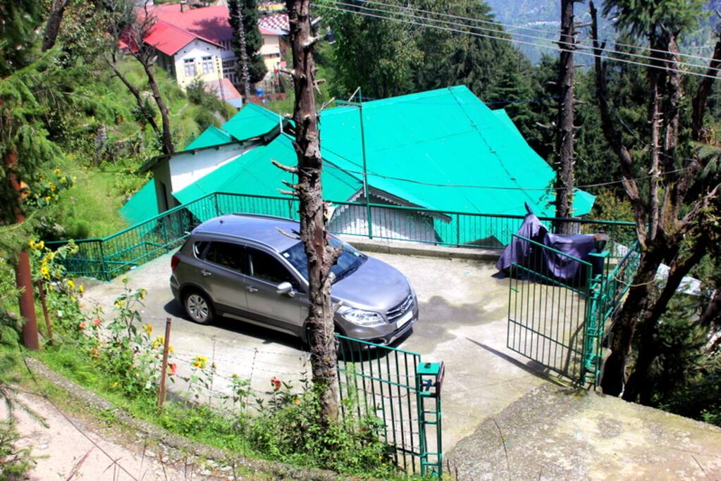 parking area and view of cottage from the road
