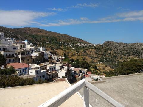 Cycladic house with view in the village heart