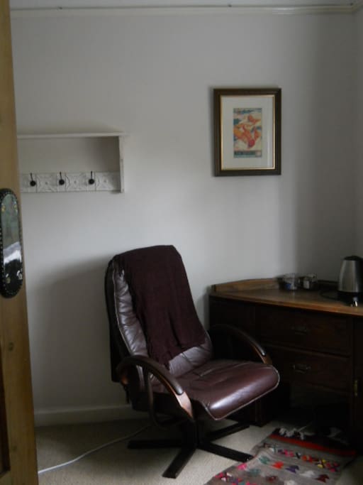 writing desk and chair in guest room.