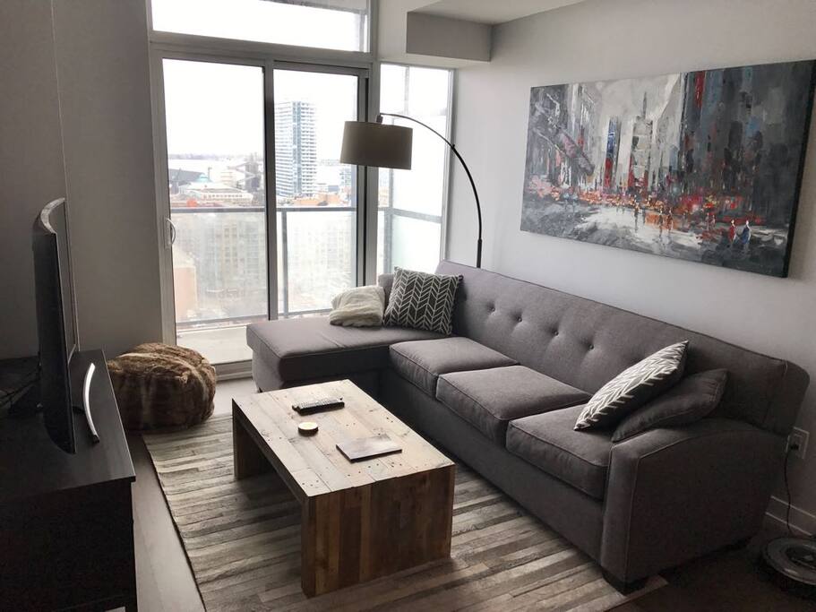 Over-sized custom couch and 55-inch TV
