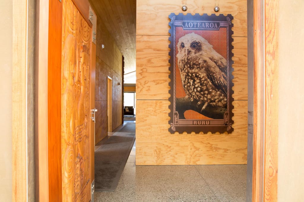 Beautiful entrance way, with carved door by local artist.
