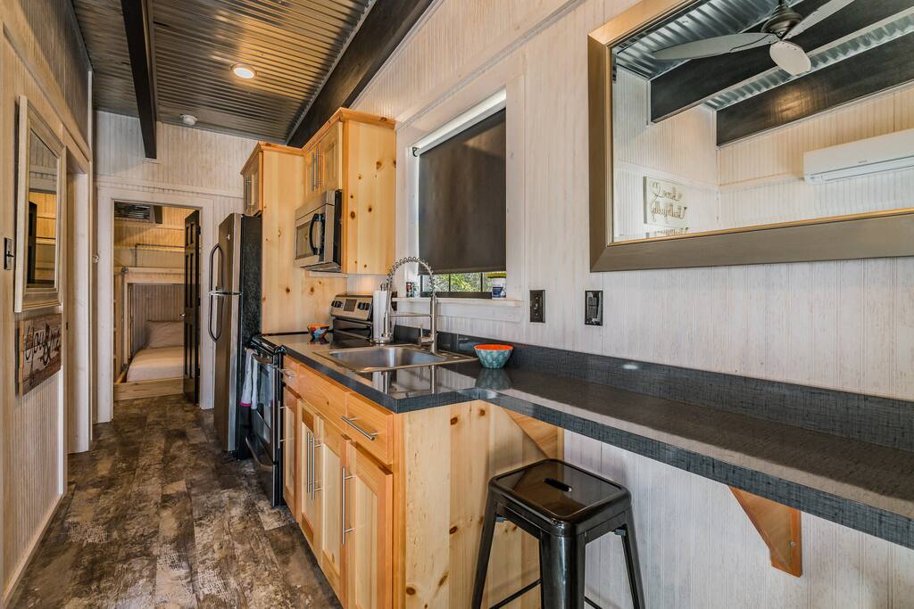 Full kitchen equipped with dishes and necessities.